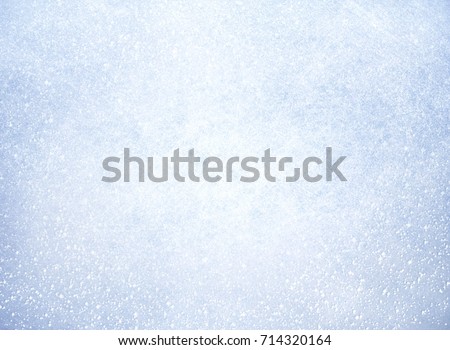 Frozen texture covered by a thin layer of snow - Winter material