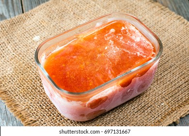 Frozen Tomato Juice In A Glass Container