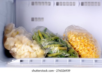 Frozen Vegetables In Bags In Freezer Close Up