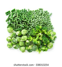 Frozen vegetables mix (green beans, peas, brussels sprout and broccoli) isolated over white, top view