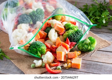 Frozen vegetables in plastic bags on a table. Frozen food - Shutterstock ID 2075446297