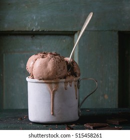 Frozen Vintage Aluminum Mug With Melting Chocolate Ice Cream Balls, Served With Spoon And Chopped Dark Chocolate On Old Wooden Table. Dark Rustic Style. Space For Text. Square Image