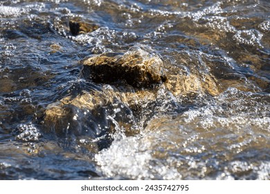 Frozen water close-up, streams of water flowing in streams. - Powered by Shutterstock