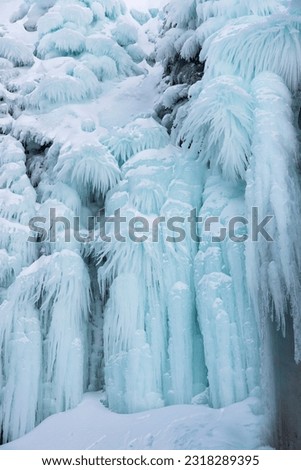 Frozen waterfall in Iceland in winter