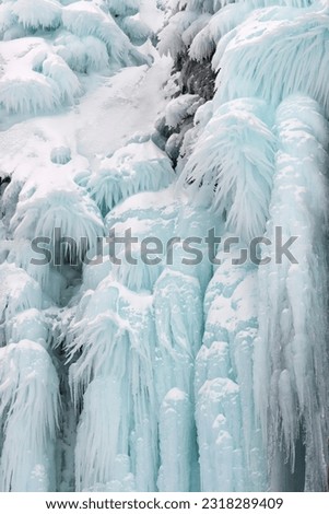 Frozen waterfall in Iceland in winter