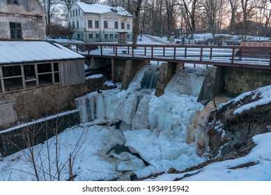 frozen waterfall near ancient watermills in an urban environment creating an impressive natural ice art work - Powered by Shutterstock