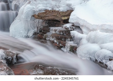 Frozen waterfall. Winter landscape with water frozen cascades