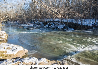 Frozen Waterfalls (Anderson Falls) And River In Winter On A Bright Sunny Day