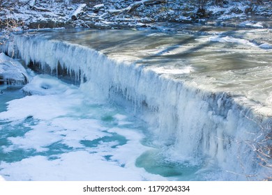 Frozen Waterfalls (Anderson Falls) And River In Winter On A Bright Sunny Day