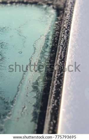 Frozen windshield in winter