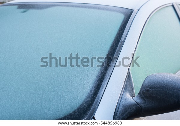 \
Frozen windshield\
wiper on car. Frozen windshield.   car windshield in winter. Frozen\
front window of a car. Frozen car windshield in winter.  Front\
Glass. Cold winter.