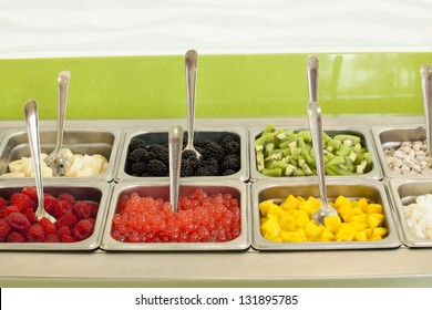 Frozen Yogurt Toppings Bar. Yogurt Toppings Ranging From Fresh Fruits, Nuts, Fresh-cut Candies, Syrups And Sprinkles.