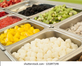 Frozen Yogurt Toppings Bar. Yogurt Toppings Ranging From Fresh Fruits, Nuts, Fresh-cut Candies, Syrups And Sprinkles.