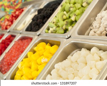 Frozen Yogurt Toppings Bar. Yogurt Toppings Ranging From Fresh Fruits, Nuts, Fresh-cut Candies, Syrups And Sprinkles.