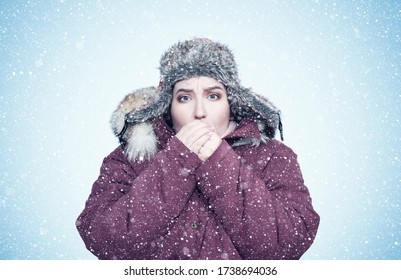 Frozen Young Girl In Winter Clothes Warms Her Hands, Cold, Snow, Frost, Blizzard