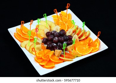 Fruit appetizer. Dark background.