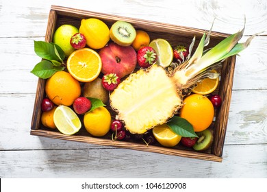 Fruit And Berries In Wooden Tray Top View..