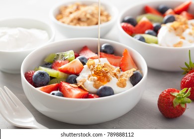 Fruit Berry Salad With Yogurt And Granola For Healthy Breakfast