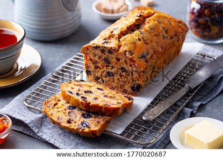 Fruit cake Bara Brith. Welsh traditional dessert. Grey background. Close up.