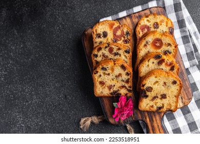 fruit cake dessert traditional pastry dried fruits, nuts meal food snack on the table copy space food background rustic top view