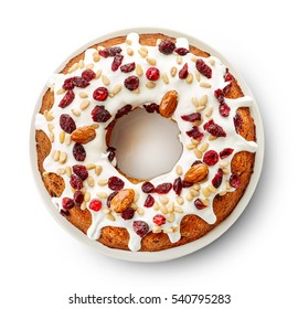 Fruit cake on white plate isolated on white background, top view