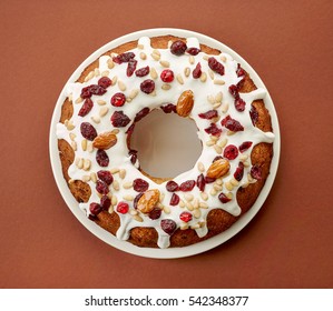 Fruit Cake On White Plate On Brown Background, Top View