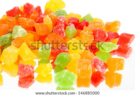 Fruit candy multi-colored on the reflective surface 
