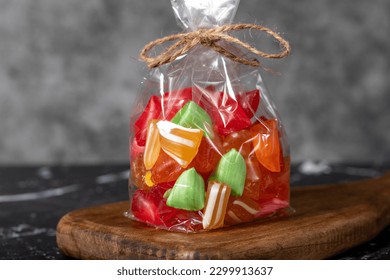 Fruit candy. Packed fruit flavored candy on a dark background. Close up