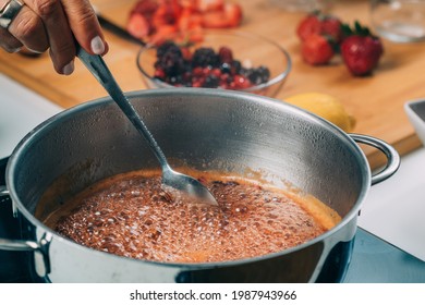 Fruit Canning Preservation. Woman Cooking Fruits And Making Homemade Jam.