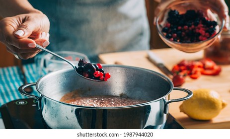 Fruit Canning Preservation. Woman Cooking Fruits And Making Homemade Jam.