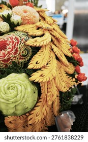 Fruit carving decorations featuring pumpkins, cantaloupes, and melons; beautiful and delicate professional craftsmanship in Thai style.