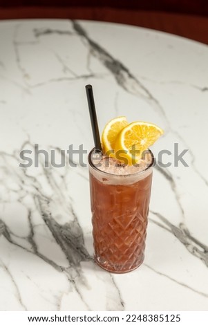 Fruit cocktail in a glass with straw
