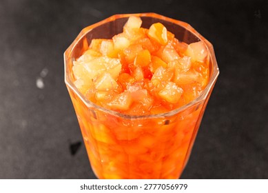 Fruit cocktail pineapple, mango, lychee, apple Canned fruit cocktail tasty snack fresh food background on the table, rustic food, top view, copy space vegetarian and vegan food