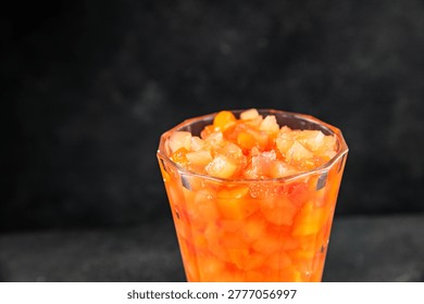 Fruit cocktail pineapple, mango, lychee, apple Canned fruit cocktail tasty snack fresh food background on the table, rustic food, top view, copy space vegetarian and vegan food