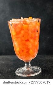 Fruit cocktail pineapple, mango, lychee, apple Canned fruit cocktail tasty snack fresh food background on the table, rustic food, top view, copy space vegetarian and vegan food