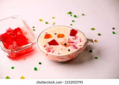 Fruit custard in a glass bowl,jelly custard,tutti frooti custard,milk custard closeup with selective focus and blur