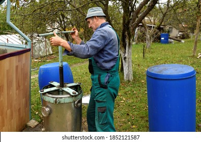 The Fruit Grower Presses Crushed Apples For Fruit Juice