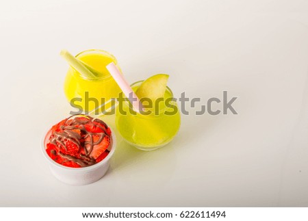 Fruit ice cream, decorated with fresh fruit, chocolate covered, yellow drinks , summer