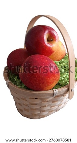 Fruit image showing a rustic wicker-style hamper overflowing with orchard-fresh apple treasures. Photograph of a curated basket of hand-plucked, crunchy apples for the autumn season. Isolated image of a thoughtful, garden-harvested apple display. Photo of a woven container of crisp, homegrown pomes. Juicy red apples elevated for gift or present in a rustic, country-style basket. Healthy Gifting image. Apple picking, autumn harvest, countryside living. Wicker basket of ripe-apples. Small rustic basket of red-apples
Rustic wicker-style container of fresh fruit.