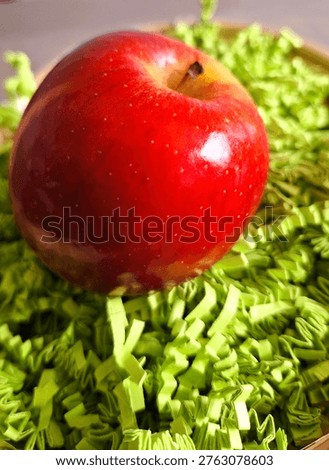 Fruit image showing a rustic wicker-style hamper overflowing with orchard-fresh apple treasures. Photograph of a curated basket of hand-plucked, crunchy apples for the autumn season. Isolated image of a thoughtful, garden-harvested apple display. Photo of a woven container of crisp, homegrown pomes. Juicy red apples elevated for gift or present in a rustic, country-style basket. Healthy Gifting image. Apple picking, autumn harvest, countryside living. Wicker basket of ripe-apples. Small rustic basket of red-apples
Rustic wicker-style container of fresh fruit.