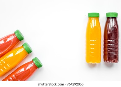 Fruit Juice In Plastic Bottle On White Table Top View Mockup