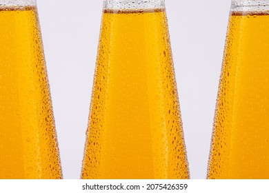 fruit juice plastic cold bottles of water with drops isolated on white background,Close-up - Shutterstock ID 2075426359
