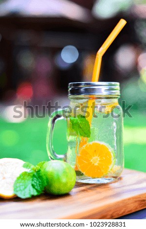 Similar – Infused fruit water cocktails and woman drinking green smoothie