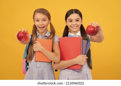 Fruit Of Knowledge. Happy Teen Girls With Books Show Apples. Food Knowledge