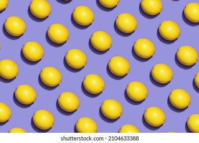 Fruit lemon in checkered pattern on violet background. Violet and yellow colors background from fruity lemon. Demonstrating very peri, color of 2022 year