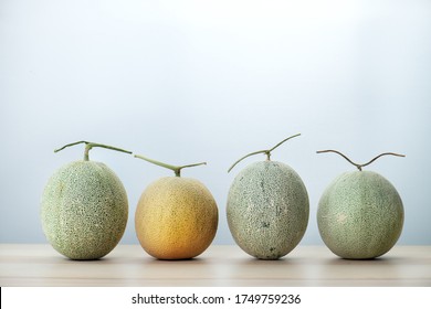 Fruit melon and white background. Fresh Hami melon ,japanese melon orange and green honeydew. look like cantaloupe but more sweet and fragrant . Eat by Break or slice cut to piece and crescent.