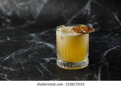 Fruit Mixology With Mezcal And Dry Lime On Black Marble Background. Warm Colored Cocktails. Mezcal Cocktail