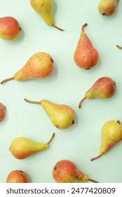 
Fruit pattern of pears on a green background. Summer aesthetic food concept.