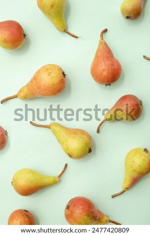 
Fruit pattern of pears on a green background. Summer aesthetic food concept.