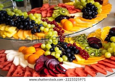 fruit platter with grapes, watermelon, kiwi, mango, apple and others. Party fruit arrangement. 